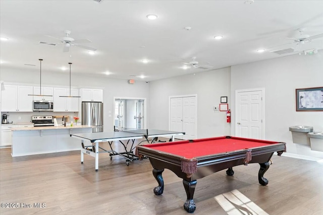 recreation room featuring ceiling fan, pool table, and light wood-type flooring