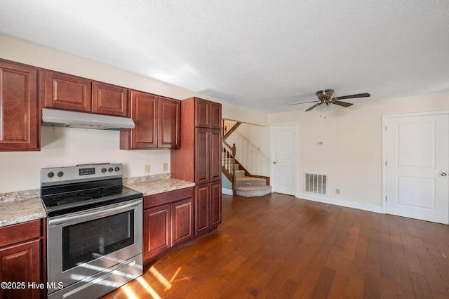 kitchen featuring stainless steel range with electric stovetop, ceiling fan, dark hardwood / wood-style flooring, and a textured ceiling