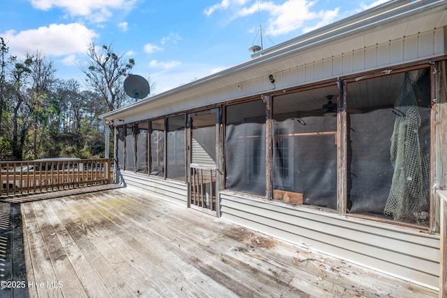 deck with a sunroom