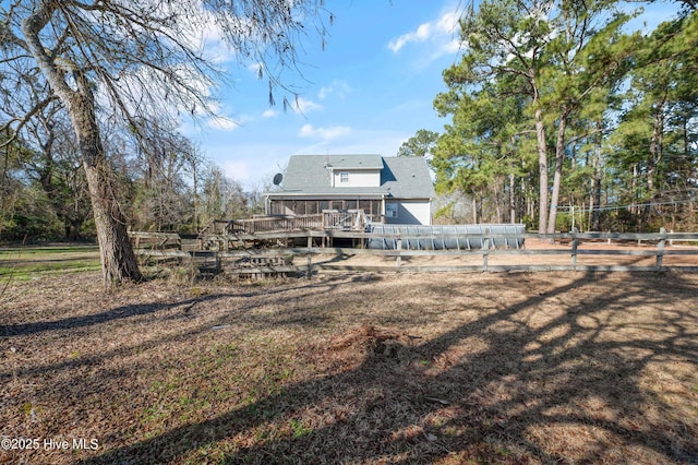 rear view of house featuring a deck