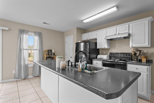 kitchen with an island with sink, sink, white cabinets, light tile patterned floors, and black appliances