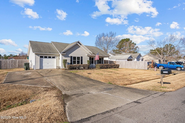 single story home with a garage and a front lawn