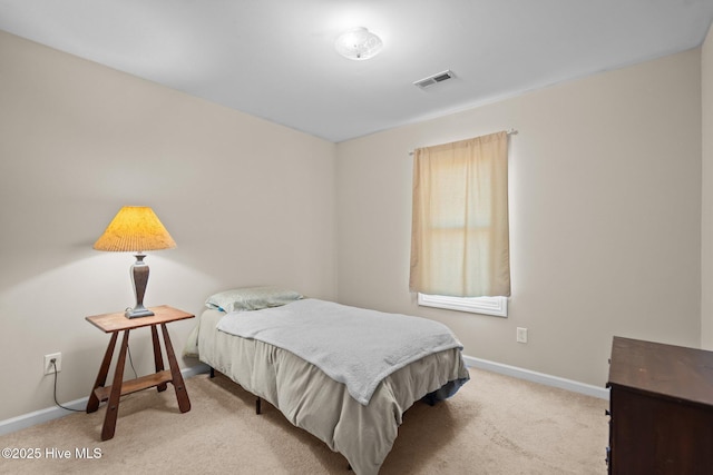 bedroom with light colored carpet