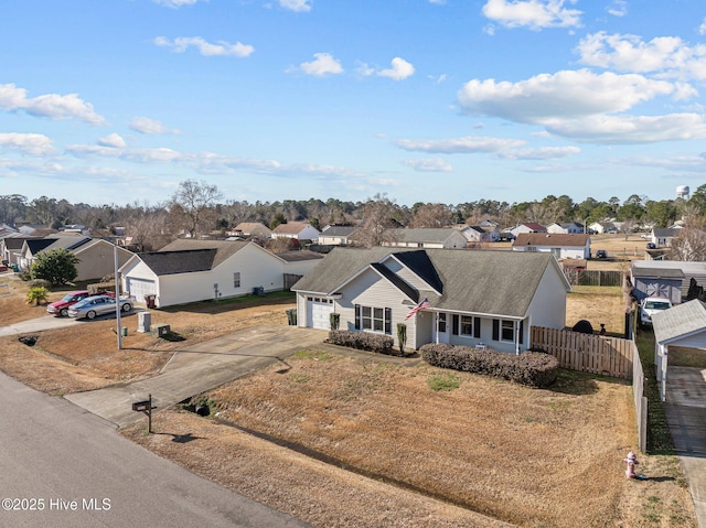 view of front of property featuring a garage and a front lawn