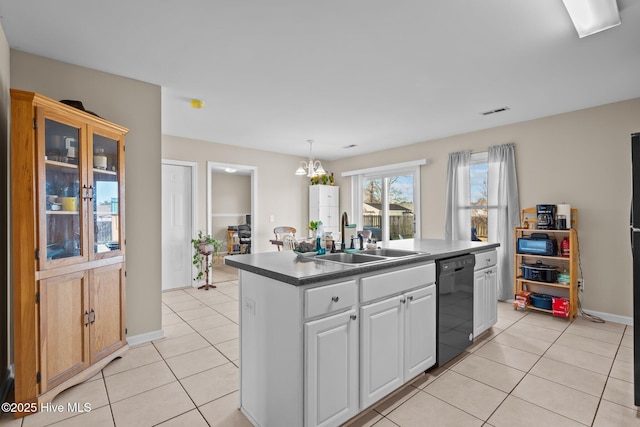 kitchen featuring an island with sink, black dishwasher, sink, white cabinets, and light tile patterned floors