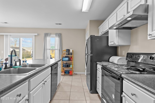 kitchen with white cabinetry, light tile patterned floors, sink, and black appliances