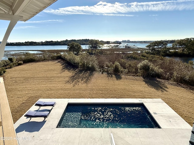 view of pool featuring a water view and a patio