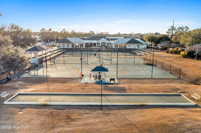 view of property's community with tennis court