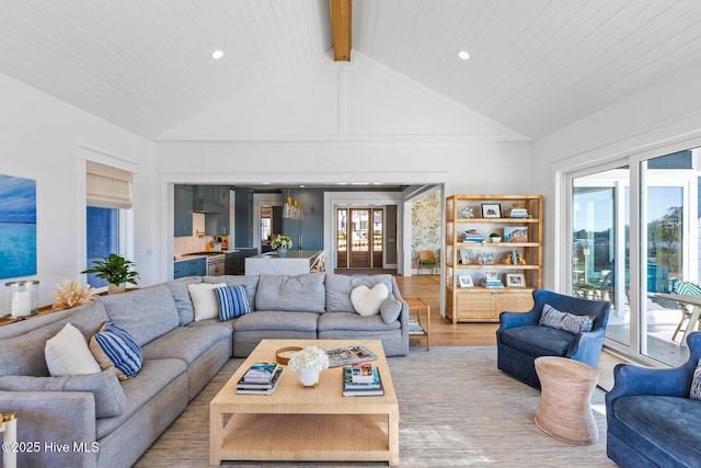 living room featuring high vaulted ceiling, beam ceiling, and light hardwood / wood-style floors