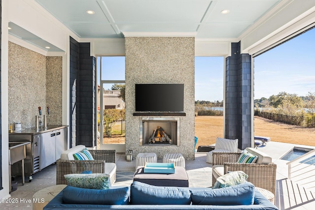 view of patio / terrace with an outdoor living space with a fireplace