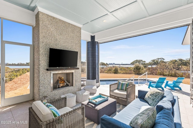 view of patio featuring an outdoor living space with a fireplace