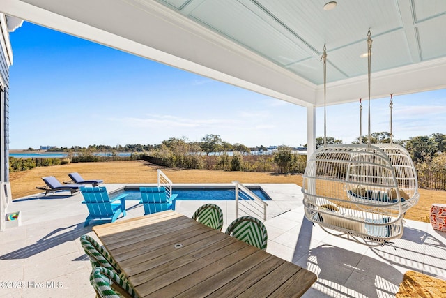 view of pool featuring a patio and ceiling fan