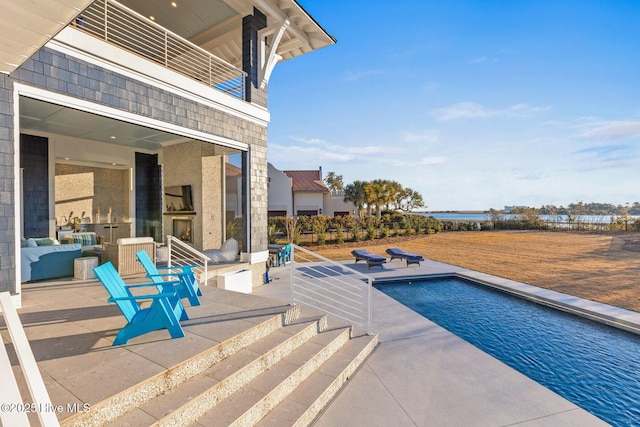 view of pool featuring a patio