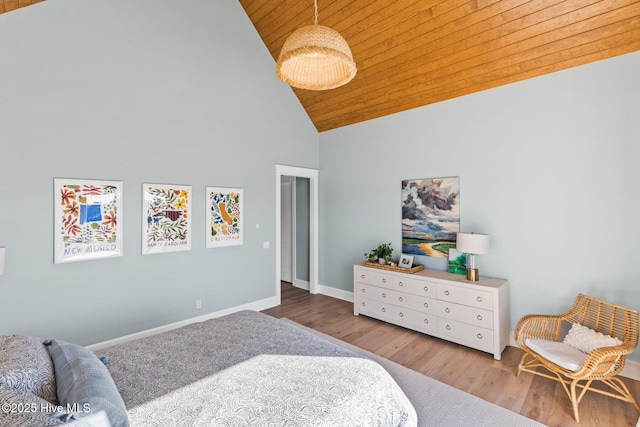 bedroom featuring light wood-type flooring, wooden ceiling, and high vaulted ceiling