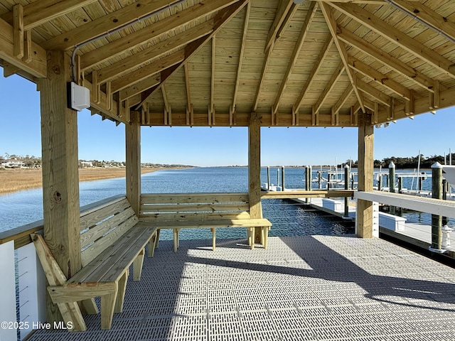 view of dock with a gazebo and a water view