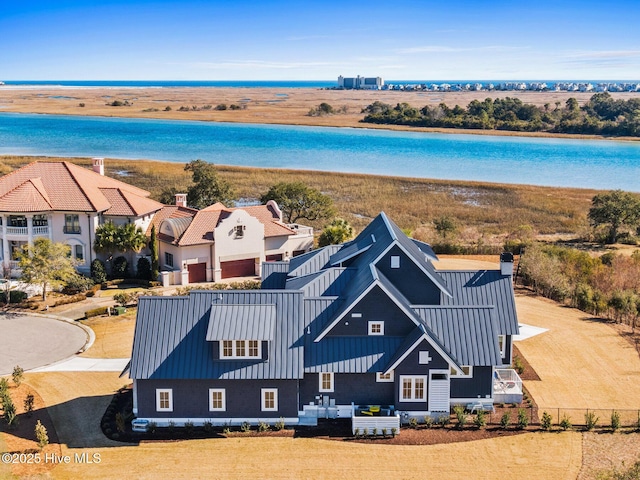 drone / aerial view with a water view