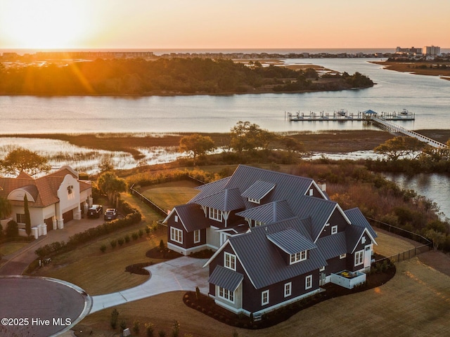 aerial view at dusk with a water view