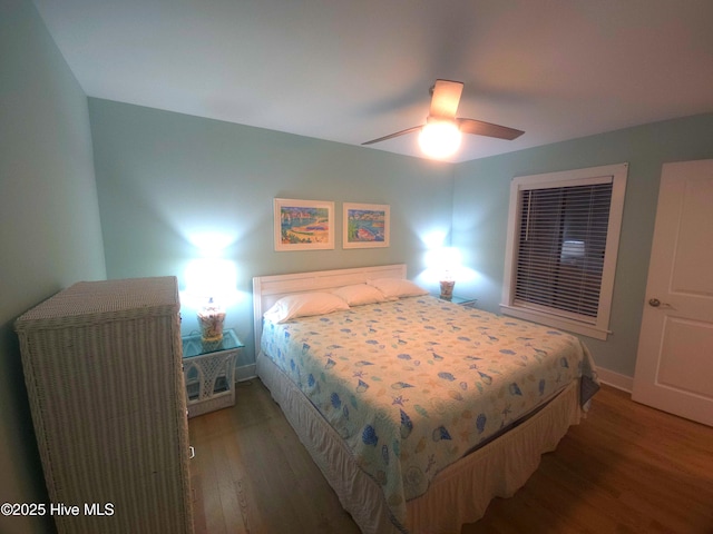 bedroom featuring ceiling fan and dark hardwood / wood-style flooring