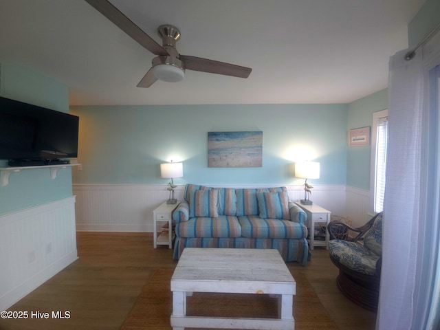 living room featuring hardwood / wood-style floors and ceiling fan