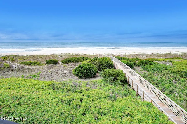 view of community with a view of the beach and a water view