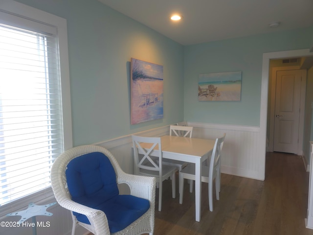 dining space with dark hardwood / wood-style flooring