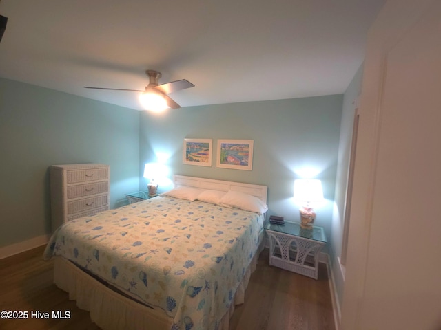 bedroom with dark wood-type flooring and ceiling fan