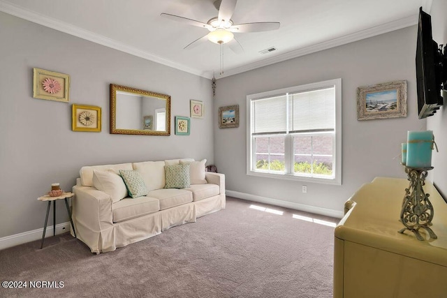 carpeted living room featuring crown molding and ceiling fan