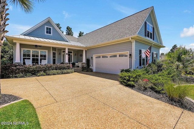 view of front of house featuring a garage and covered porch