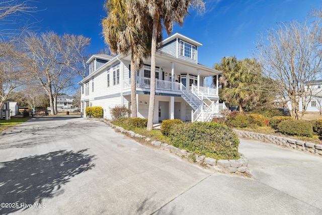 view of front of home with a garage and covered porch