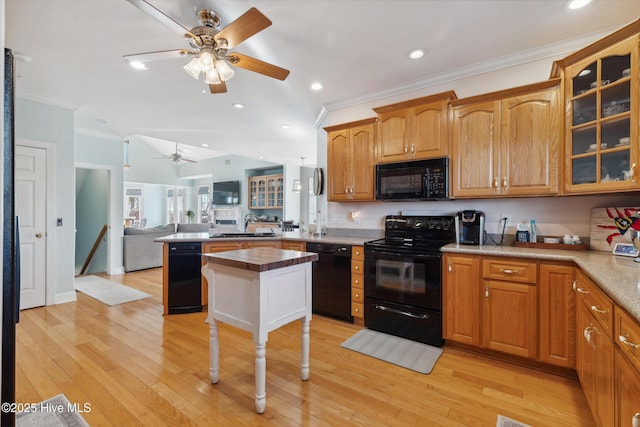 kitchen with black appliances, sink, ceiling fan, light hardwood / wood-style floors, and crown molding