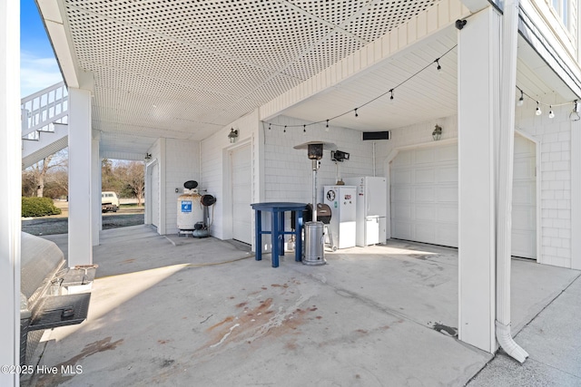 view of patio with a garage