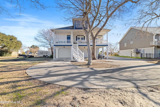 view of front of home with a garage and a porch