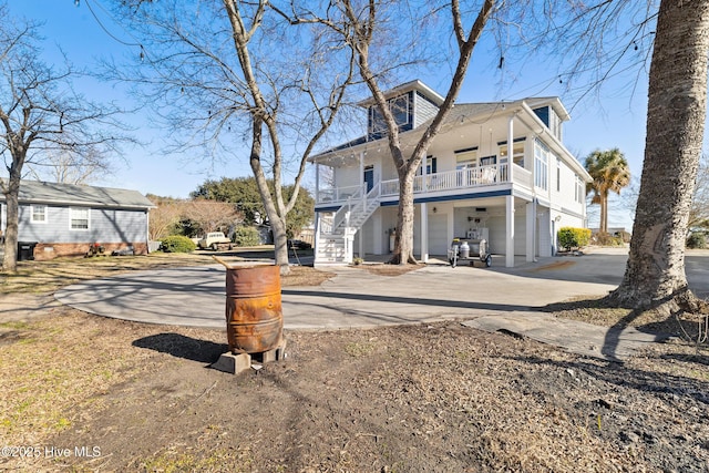 rear view of house featuring a garage