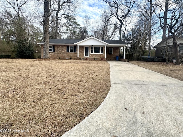 ranch-style home with a carport