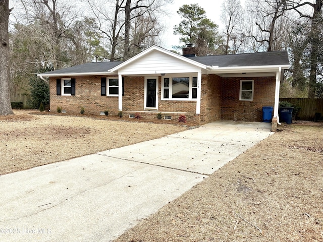 ranch-style home featuring a carport