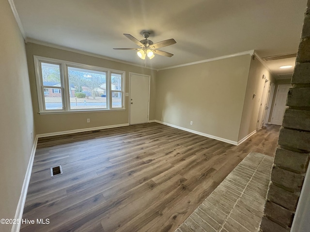 unfurnished room featuring wood-type flooring, ornamental molding, and ceiling fan