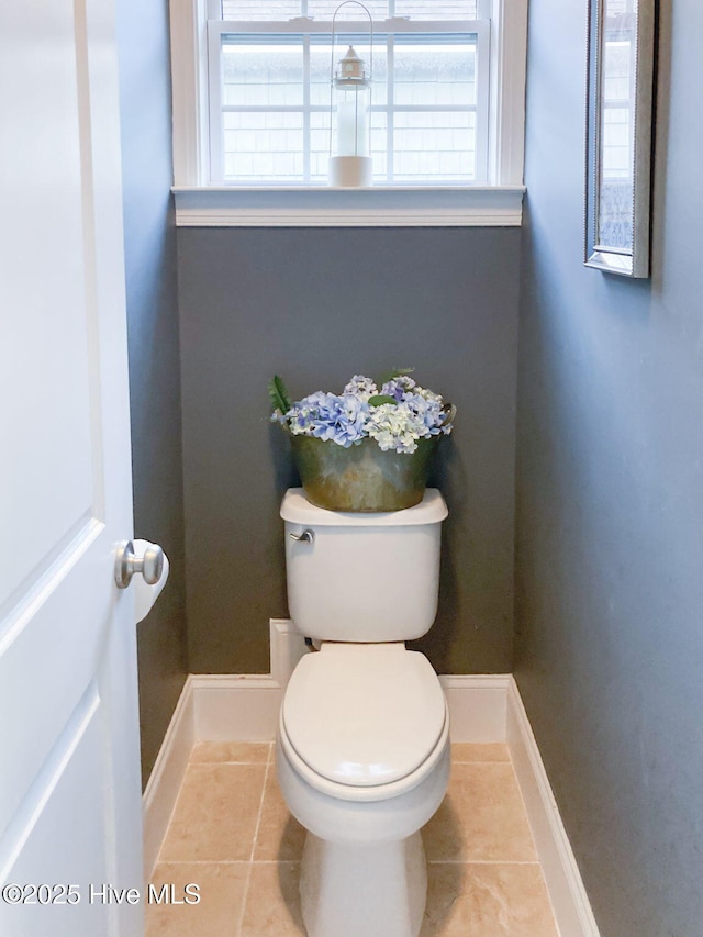 bathroom with tile patterned floors and toilet