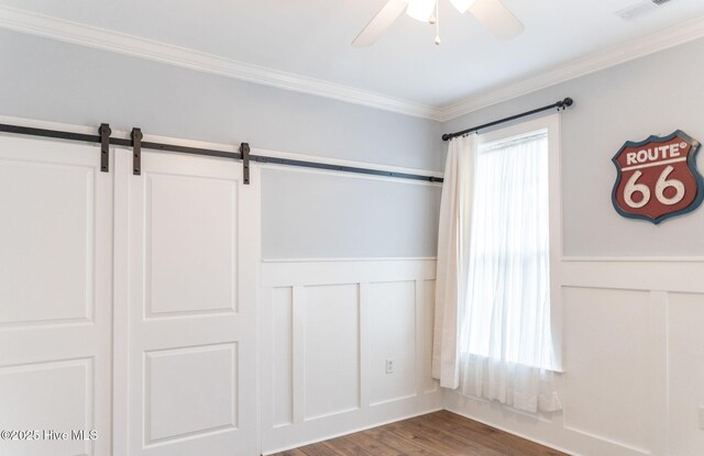 recreation room with dark hardwood / wood-style flooring and crown molding