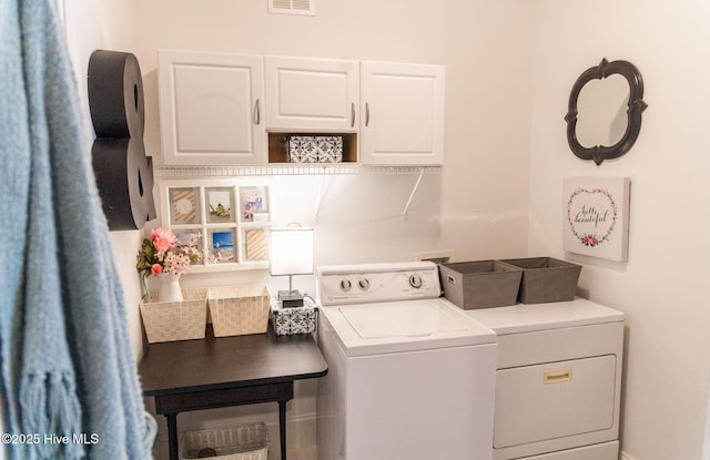 laundry area with cabinets and washer and dryer