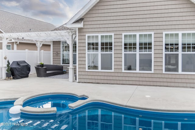 view of pool featuring a hot tub, a grill, a patio area, and a pergola