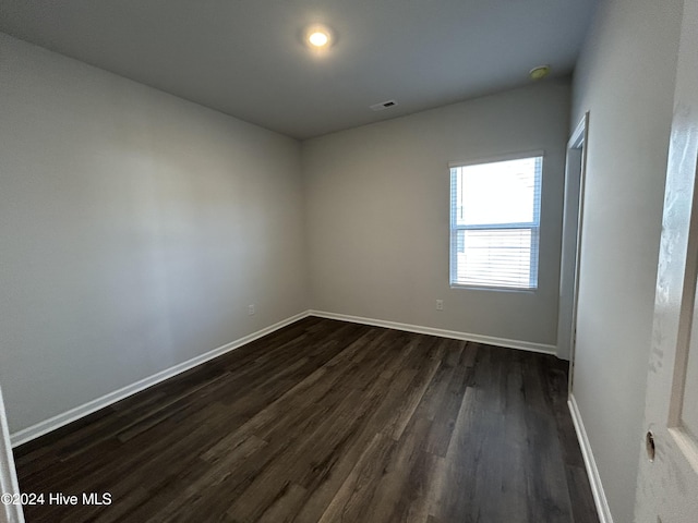 empty room featuring dark hardwood / wood-style floors