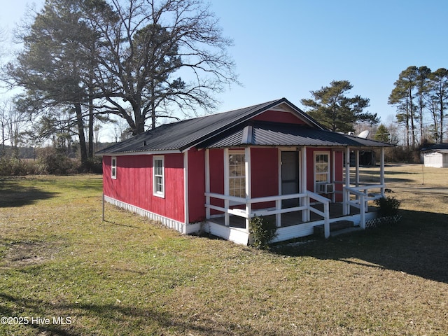 view of outbuilding with a yard