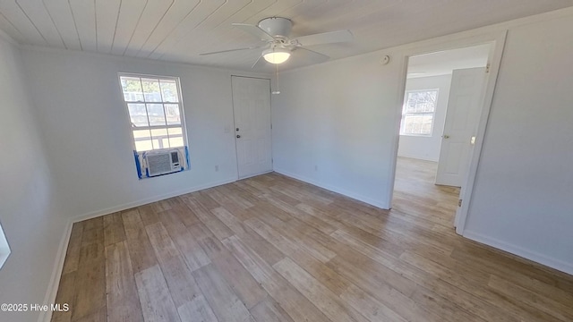 unfurnished room with cooling unit, wood ceiling, light hardwood / wood-style flooring, and ceiling fan