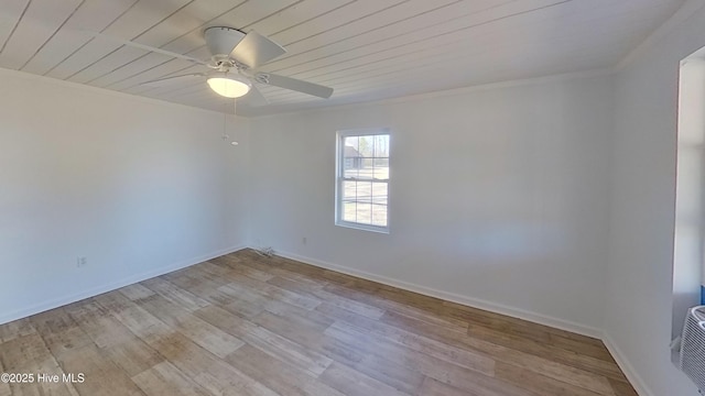 empty room featuring ceiling fan, wood ceiling, and light hardwood / wood-style floors