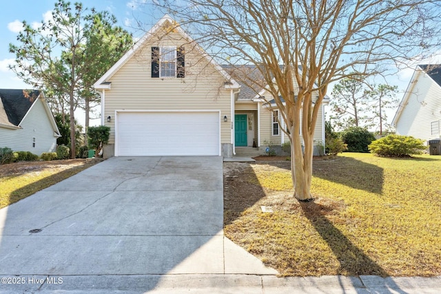 front facade featuring a garage and a front lawn