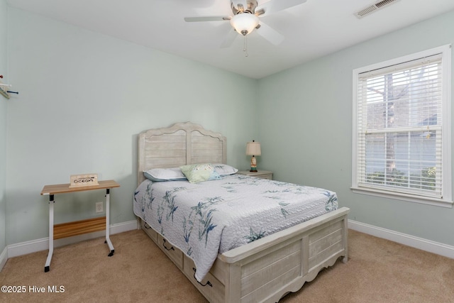 bedroom with light carpet and ceiling fan