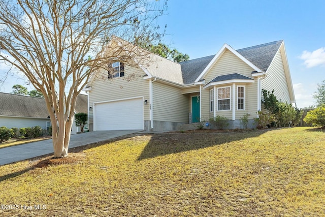 front facade featuring a garage and a front lawn