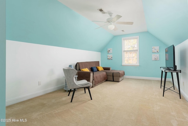 sitting room featuring lofted ceiling, light colored carpet, and ceiling fan