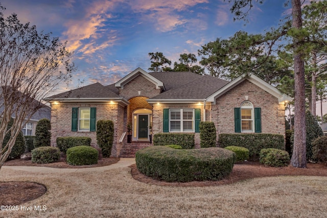 ranch-style house featuring a yard