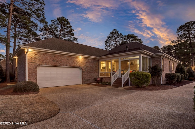 view of front of property featuring a garage and a porch